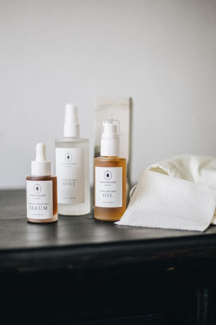 services-02 A clean beauty skincare collection in a neutral, minimalist setup showcasing luxury organic products.