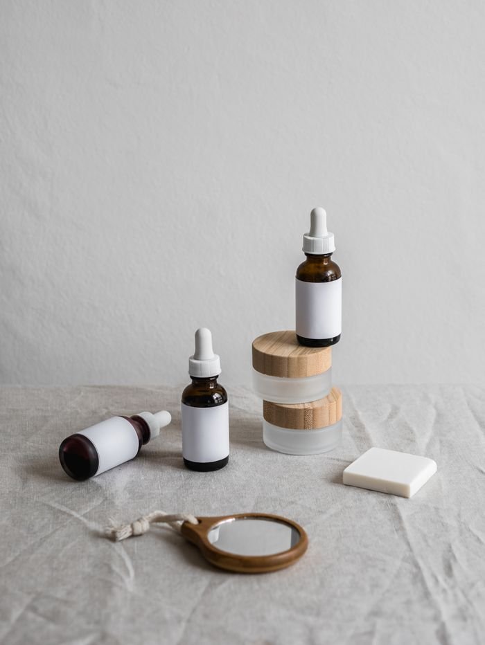 services-04 Elegant display of skincare bottles with neutral tone background, ideal for beauty branding.